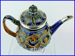 A Stunning Doulton Lambeth Silver Mounted Teapot by Edith Lupton