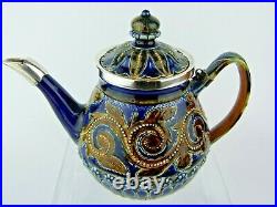 A Stunning Doulton Lambeth Silver Mounted Teapot by Edith Lupton