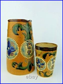 A Superb Fulham Pottery Stoneware Jug and Beaker Set. Monogrammed and Dated 1902