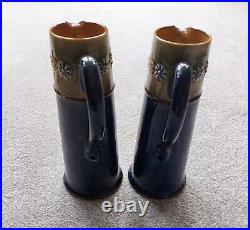 A pair of highly collectable Doulton Lambethware Art Nouveau taper jugs
