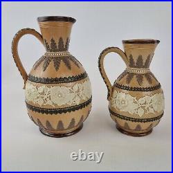 Antique Pair Graduated Doulton Lambeth Stoneware Jugs Decorated Flowers 19cm